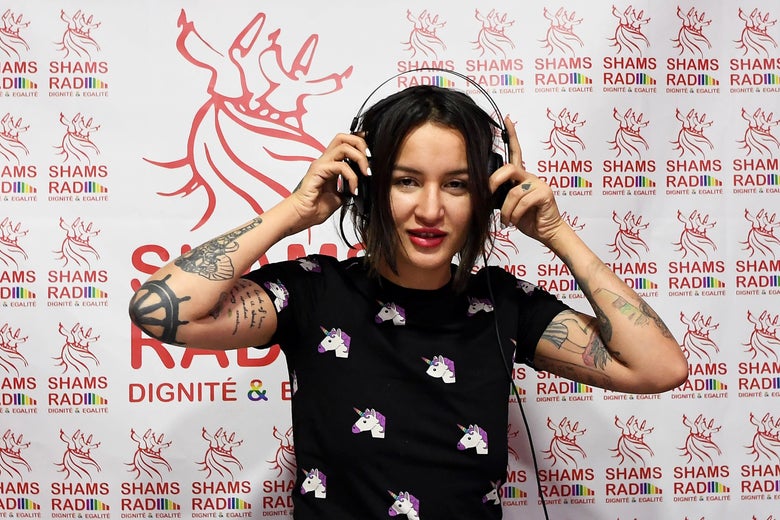 Tunisian activist Amina Sboui, also know as Amina Tyler, a radio presenter on the new 'Shams Radio', the first LGBT radio in the Arab region, poses for a photo in the studio during the opening of the radio station on December 18, 2017 in Tunis. / AFP PHOTO / FETHI BELAID (Photo credit should read FETHI BELAID/AFP/Getty Images)
